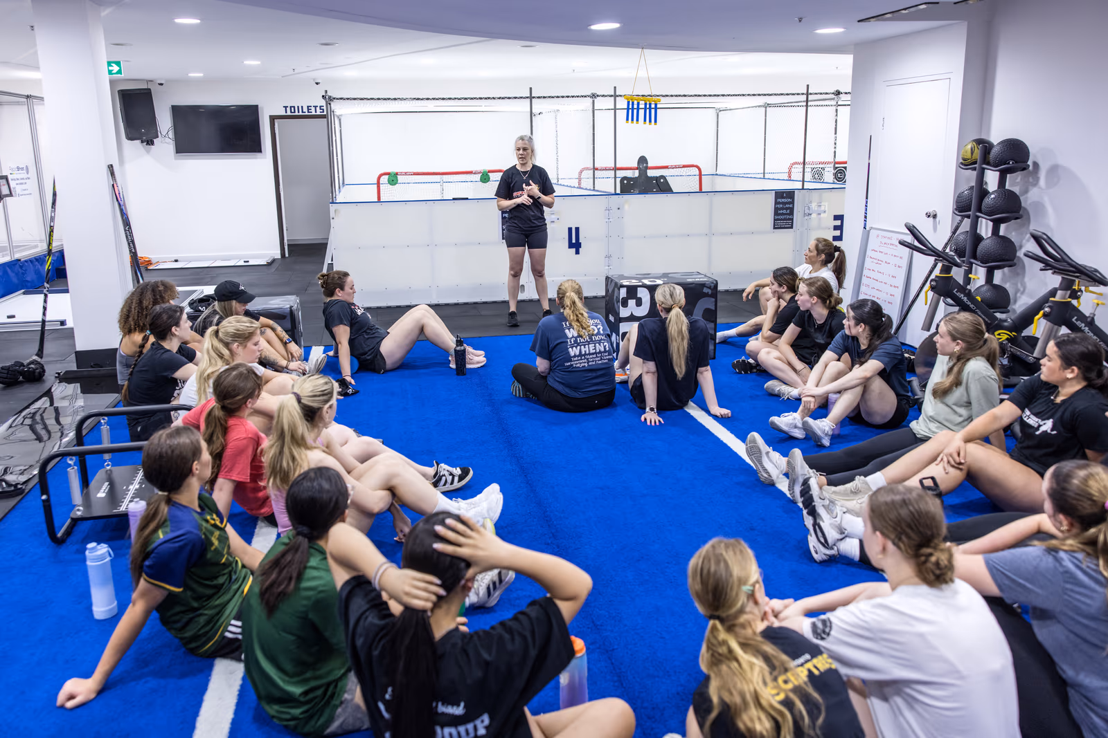 Young players gathered with a coach at a VPL holiday camp